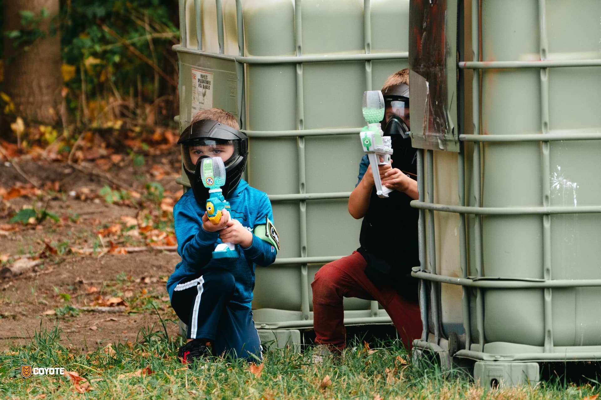 Kids playing gellyball with gel blasters at Coyote Field