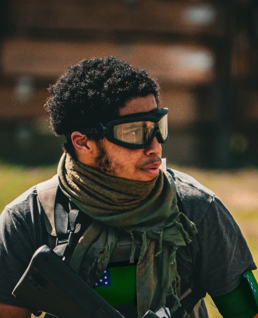 Free Alliance fighter in civilian clothes, a green scarf, and a green armband